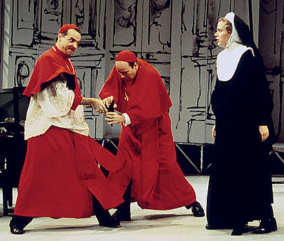 Cardinal Stillaci (John Hines) attempts to shoot the taunting 
						Elisa (Amy Cronise) while Cardinal Pialli (James Shanklin) 
						struggles to disarm him.
