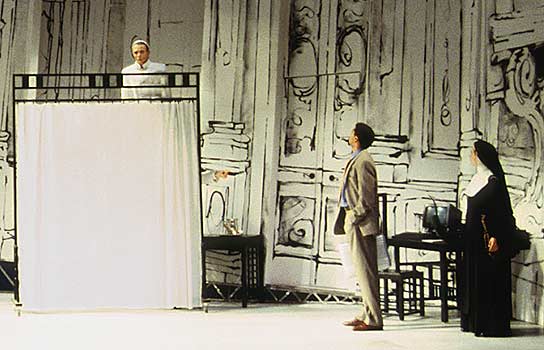 Close Up: Professor Ridolfi (Obi Ndefo) and Elisa 
							(Amy Cronise) are greeted at the Vatican 
							by a Pope dummy behind a curtain in the Pope's chambers.