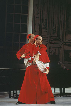 Cardinal Stillaci (John Hines) attempting to draw his gun
						while Cardinal Pialli (James Shanklin) tries to keep it under wraps.