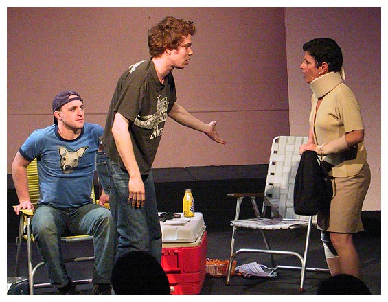 Frank (Joshua Alscher) attempts to calm Bandaged Woman (Pat Champon) after she walloped Max (Corey Patrick) with her handbag.