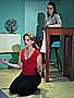 Jamie B. (Kerry Sullivan) calms her fiery temper with a bit of yoga as Kimmarie (Trista Dellyn) waits to spill the beans about Ritchie's arrival.